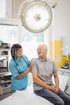 Female doctor and patient interacting with each other