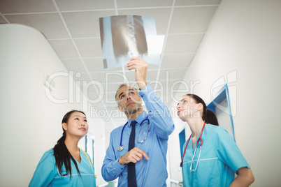 Doctor and nurses looking at x-ray