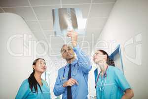 Doctor and nurses looking at x-ray