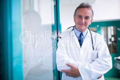 Portrait of doctor standing with arms crossed