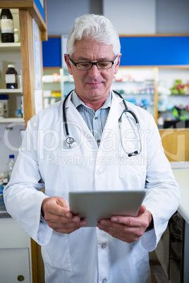 Pharmacist using a digital tablet