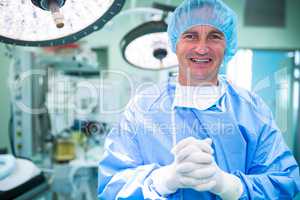 Portrait of smiling surgeons standing in operation room