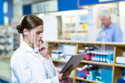 Pharmacist using digital tablet