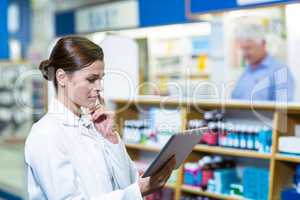 Pharmacist using digital tablet