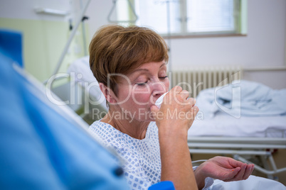 Nurse giving medication to patient