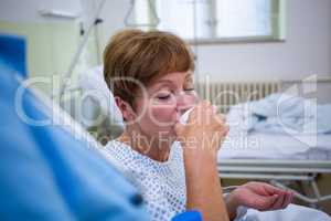 Nurse giving medication to patient