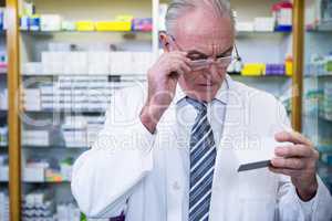 Pharmacist checking medicines