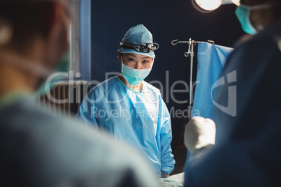 Portrait of female surgeon in operation room