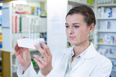 Pharmacist checking a medicine box