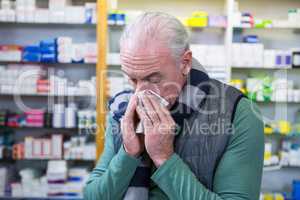 Customer covering his nose with handkerchief while sneezing