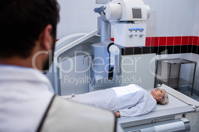 Female patient going through x-ray test