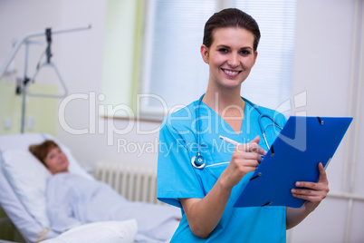 Nurse holding a medical report