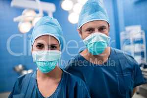 Two surgeons standing in a operation room