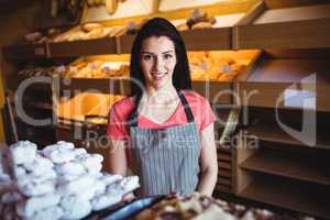 Portrait of female baker smiling