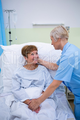 Nurse talking to a senior patient