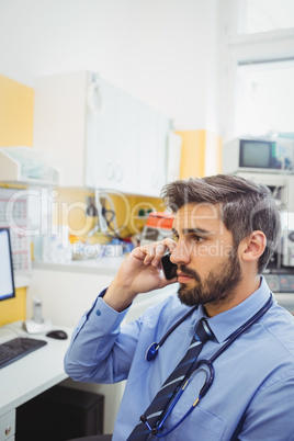 Doctor talking on mobile phone