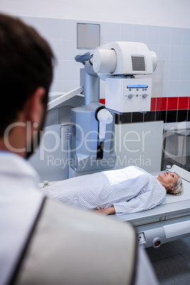 Female patient going through x-ray test