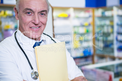 Pharmacist holding a file