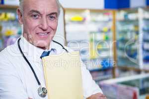 Pharmacist holding a file