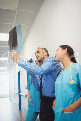 Doctor and nurses looking at x-ray