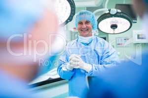 Portrait of smiling surgeons standing in operation room