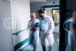 Blur view of doctors walking in corridor
