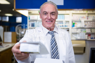 Pharmacist holding a medicine box