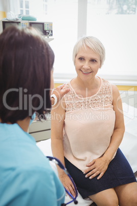 Female doctor consoling a patient