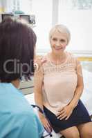 Female doctor consoling a patient