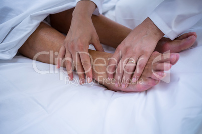 Doctor giving foot treatment to patient