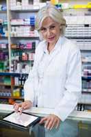 Pharmacist using a digital tablet