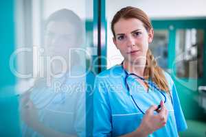 Portrait of surgeon standing in surgical room