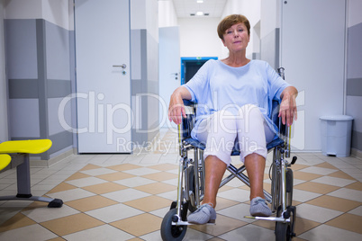 Sad senior patient sitting on a wheelchair
