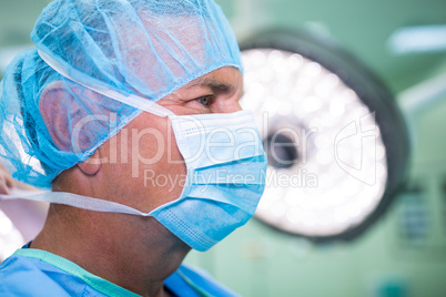Close-up of surgeon in surgical mask and cap
