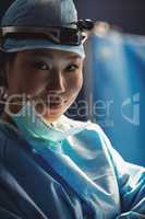 Portrait of smiling female surgeon in operation room