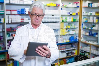 Pharmacist using a digital tablet