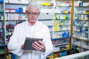 Pharmacist using a digital tablet