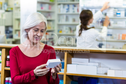 Customer checking a pill box