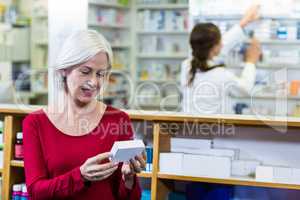 Customer checking a pill box