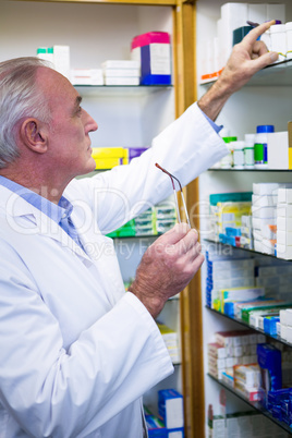 Pharmacist checking medicines in pharmacy