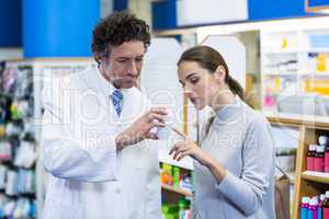 Pharmacist assisting the pills to customer