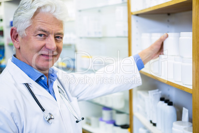 Pharmacist checking medicines in pharmacy