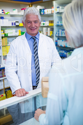 Pharmacist standing at counter