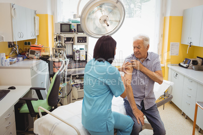 Female doctor giving an injection to a patient