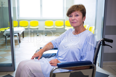 Portrait of sad senior patient sitting on a wheelchair