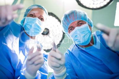 Surgeons performing operation in operation room