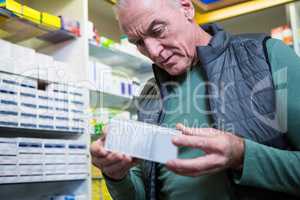 Customer checking a pill box