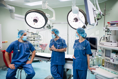 Surgeons talking to each other in operation room
