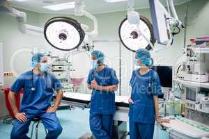 Surgeons talking to each other in operation room