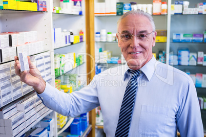 Pharmacist checking medicines in pharmacy